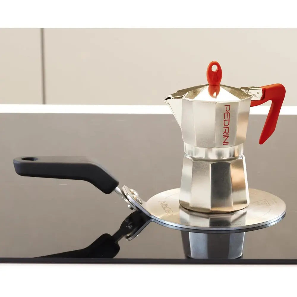 Moka pot on an iduction plate adaptor on an induction stove