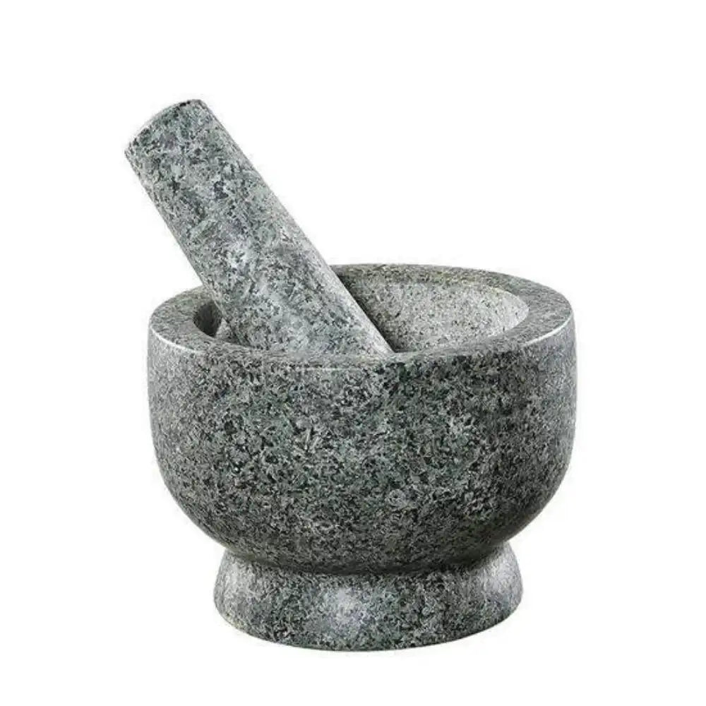 Gray stone mortar and pestle on a white background
