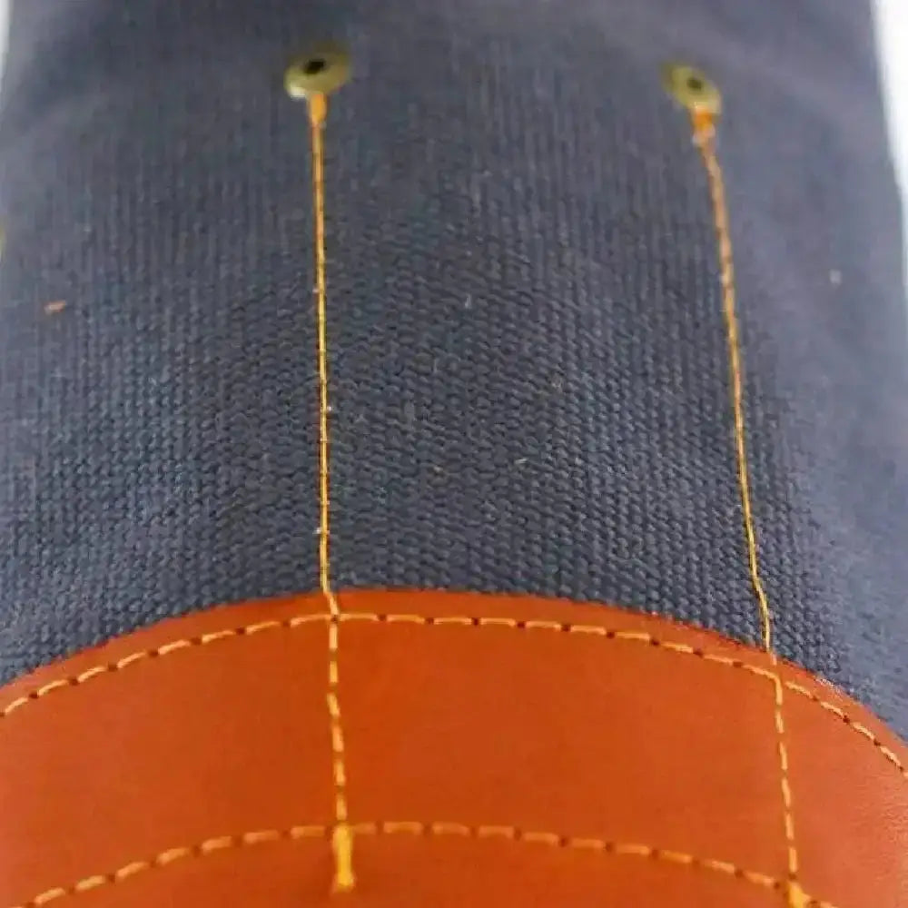 Dark blue denim cap with orange leather panel and yellow stitching paired with pieter de jager charcoal knife roll