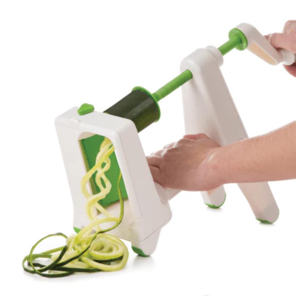 Spiralizer with zucchini noodles on a white background