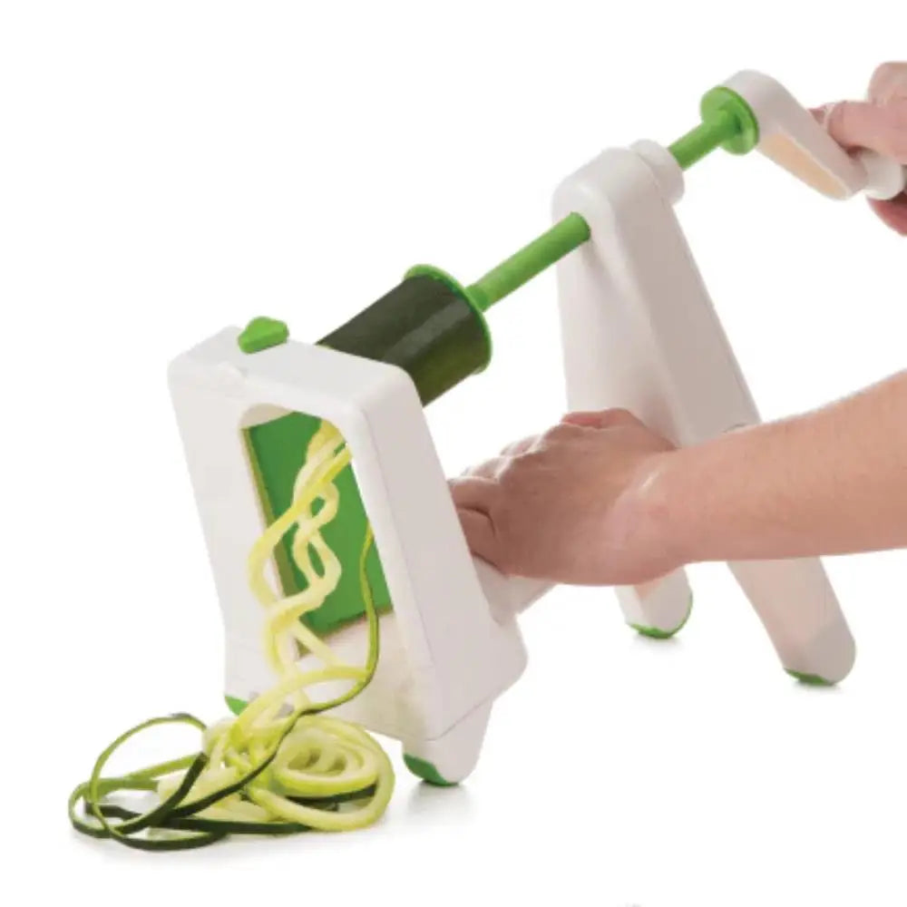 Spiralizer with zucchini noodles on a white background