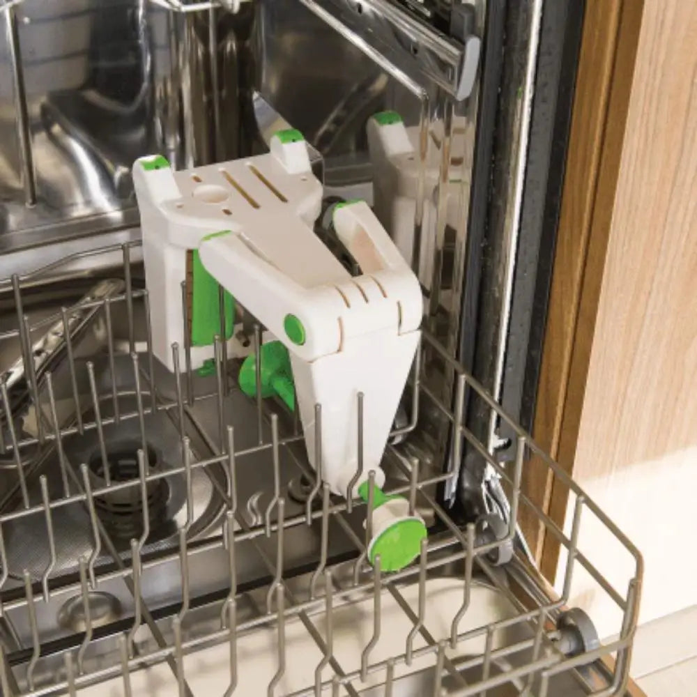 Dishwasher with a white and green kitchen tool inside