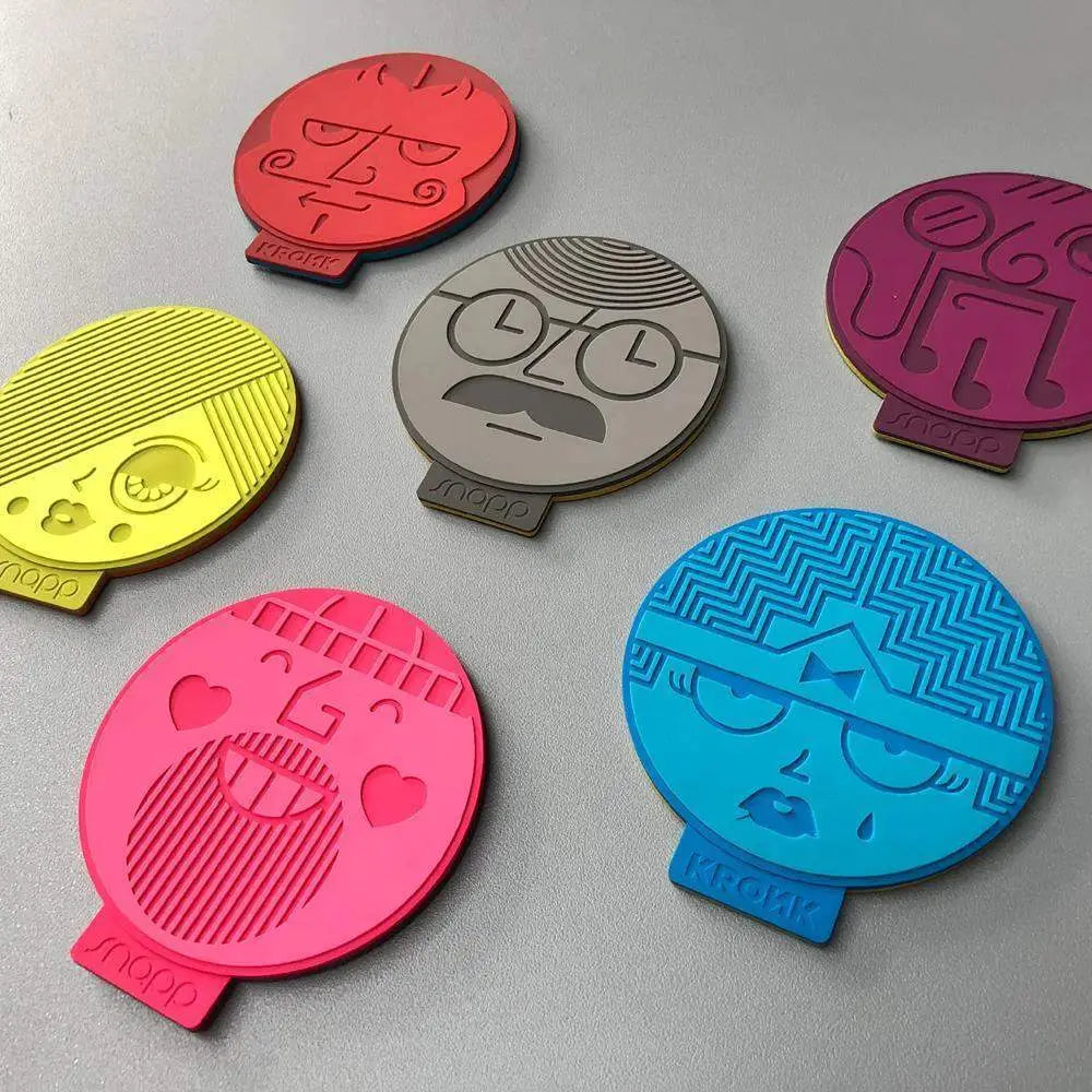 Vibrant circular snap design silicone two-faced coasters set of 6 with stylized cartoon faces in bold colors