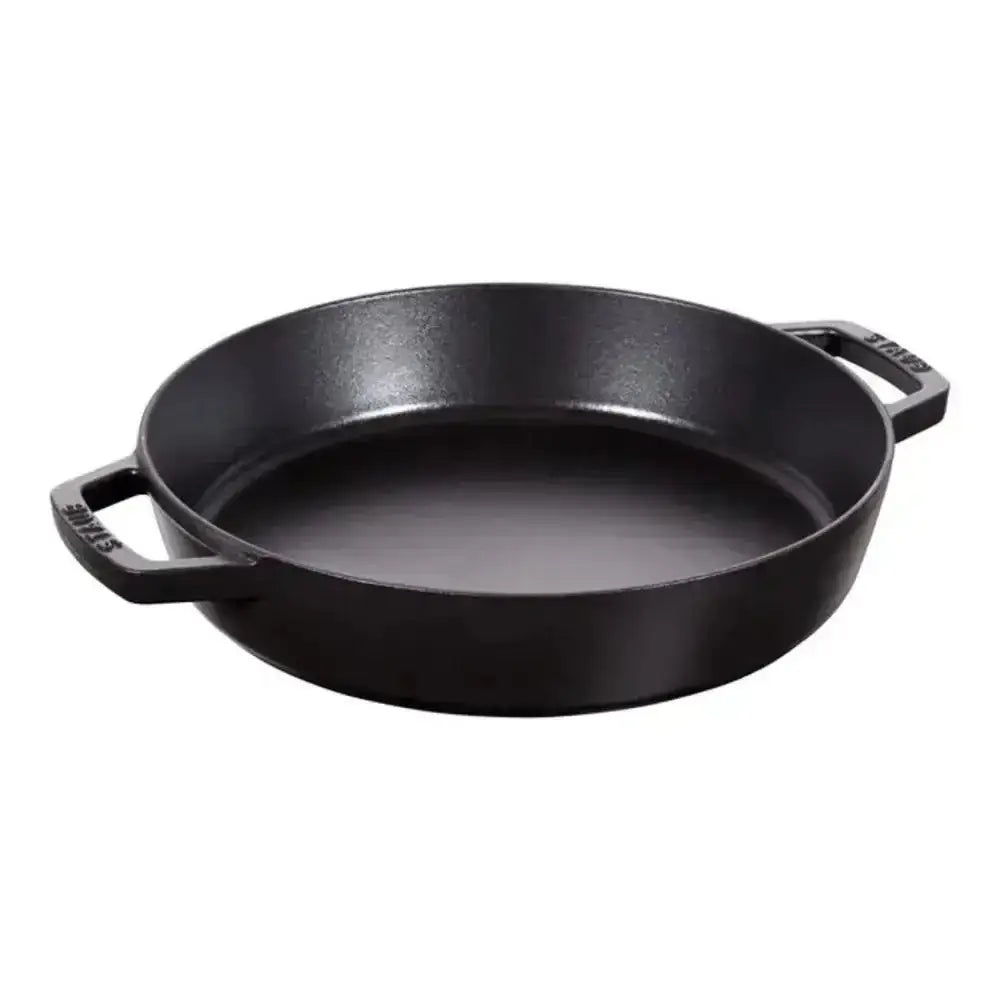 Black cast iron braising pan 26cm with two sturdy handles featuring staub brand logo engraved on each handle