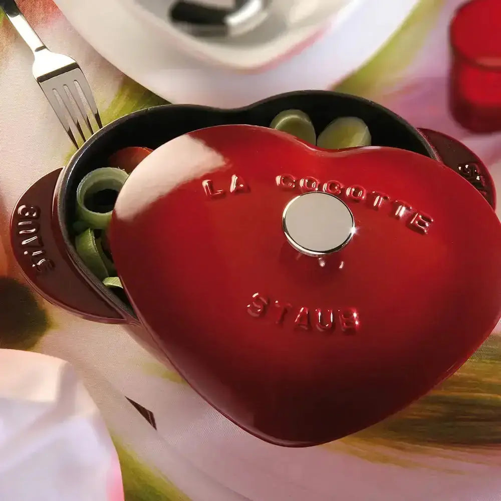 Staub cast iron cherry heart cocotte 1.75l vibrant red enamel finish with la cocotte staub branding on lid