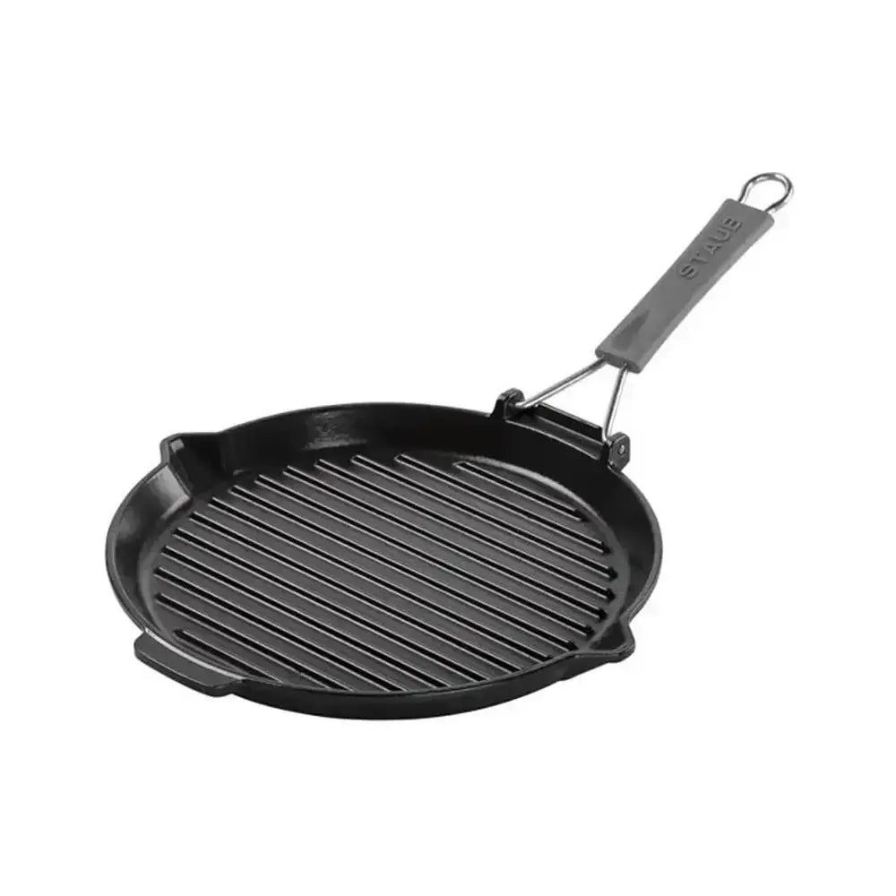 Black cast iron grill pan with handle on a white background