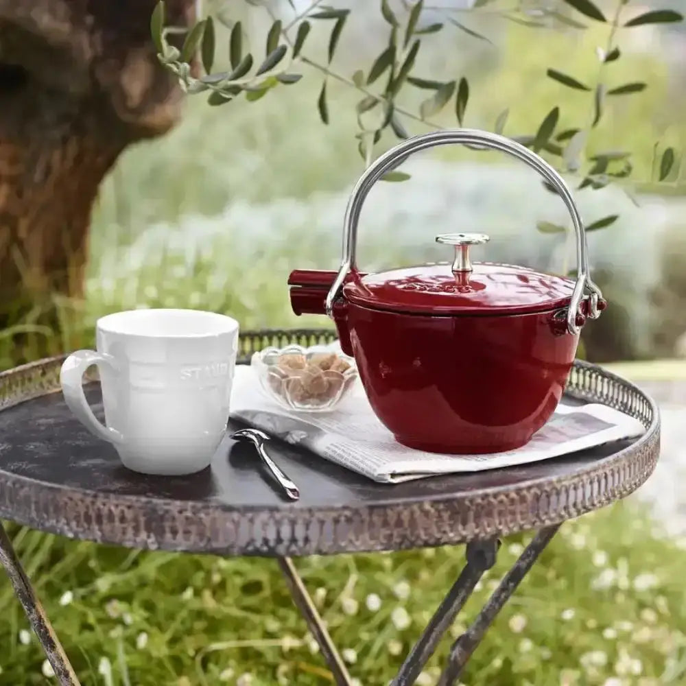 Staub cast iron round tea pot 1.15l grenadine red with vibrant red body and polished silver handle and lid knob