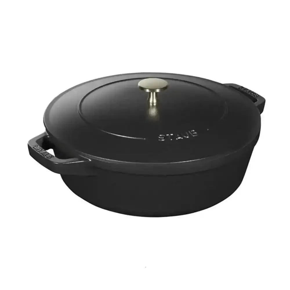Black cast iron dutch oven with gold-toned lid knob and side handles from staub cast iron stackable 4 piece cookware set