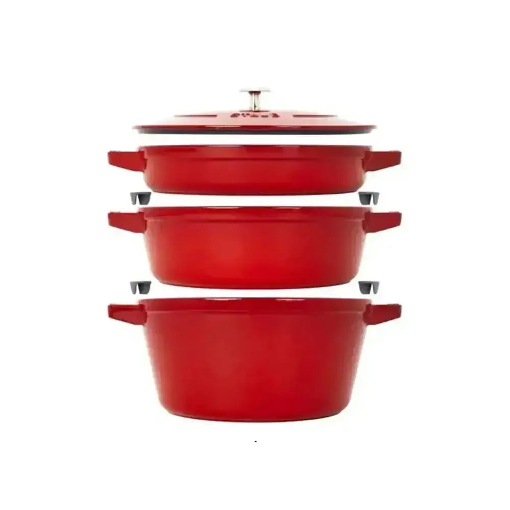 Red Staub cast iron stackable 4 piece cookware set with tiered steamer pots black handles and matching lid