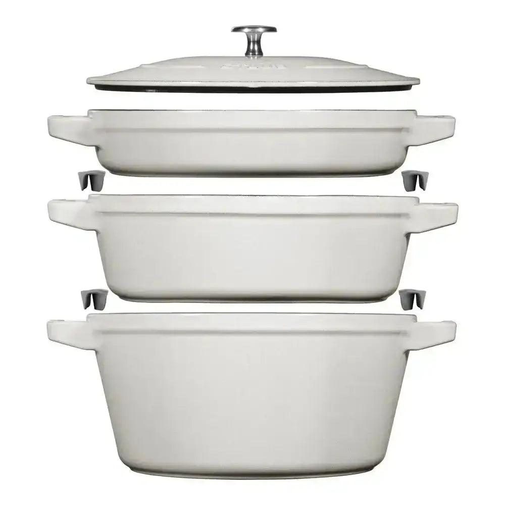 Set of three white enameled cast iron casserole dishes with lids from Staub cast iron stackable 4 piece cookware set