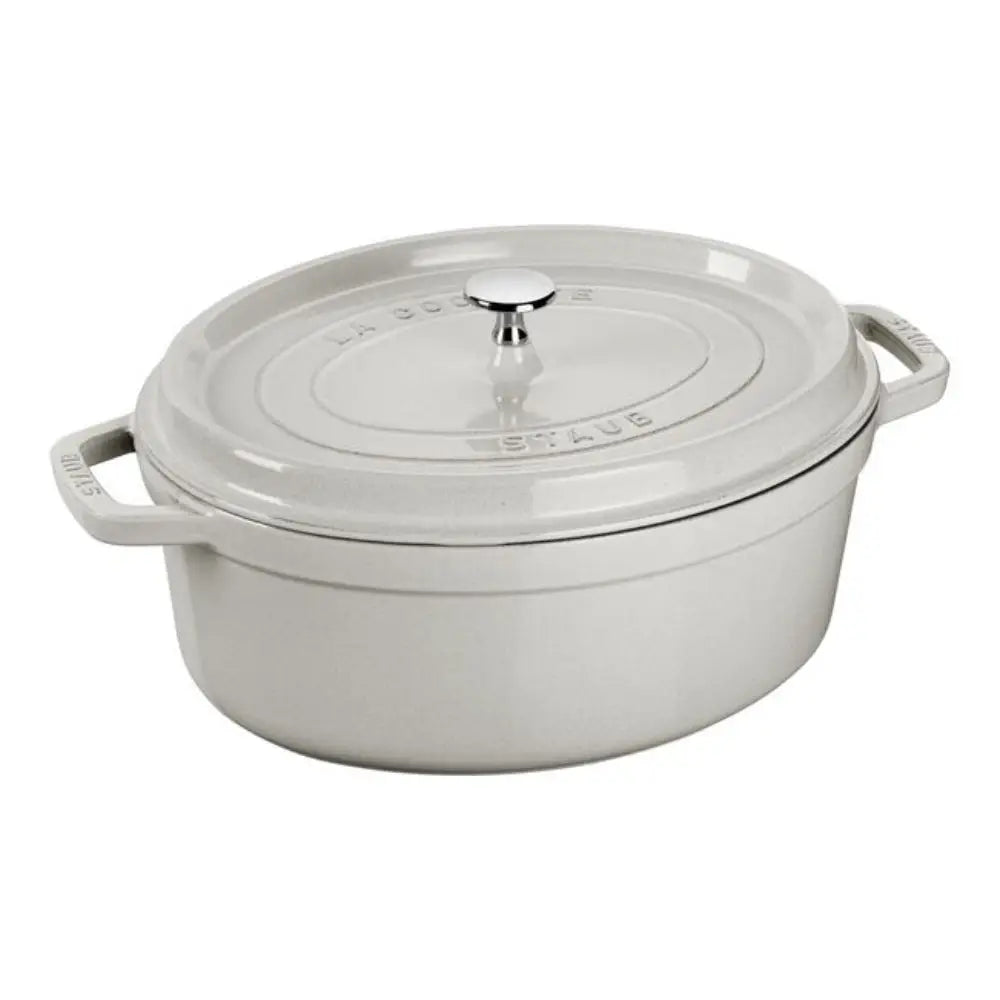 White enameled cast iron Dutch oven with lid on a white background