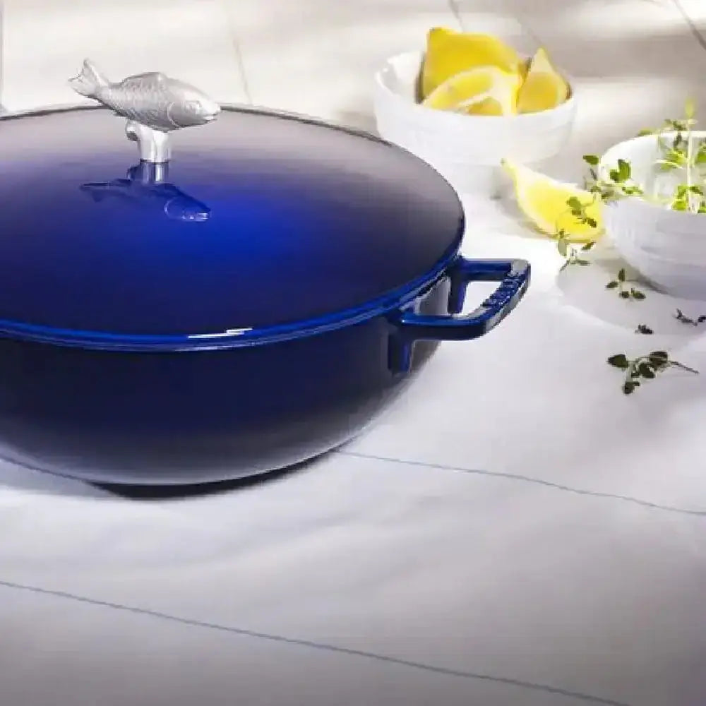 Staub round cast iron bouillabaisse pot 4.7l deep blue enameled cast iron with silver fish-shaped lid knob