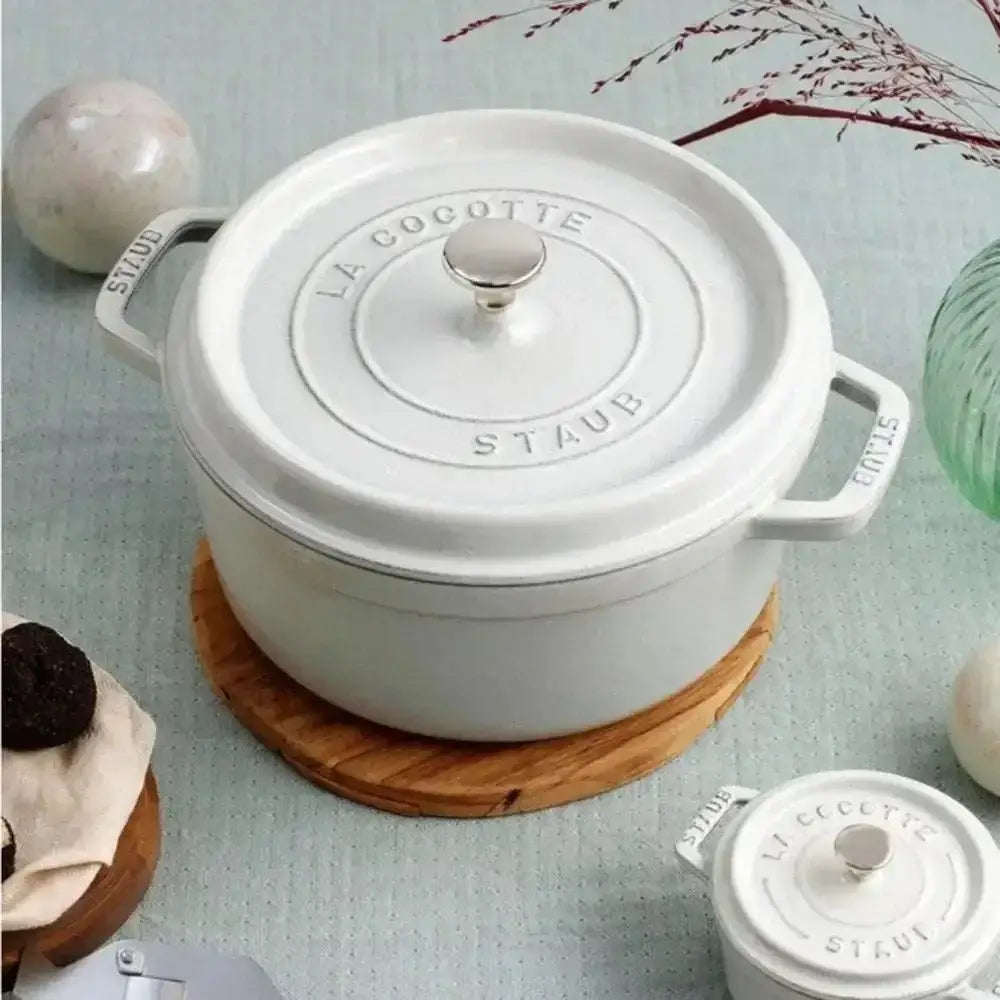 White enameled cast iron staub la cocotte dutch oven with silver lid knob and handles in 3.8l truffle color