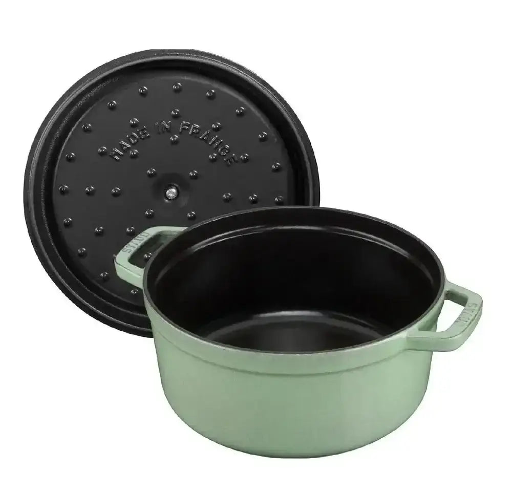 Mint green enameled cast iron Staub round dutch oven with black lid and handles 6.7L sage casserole pot