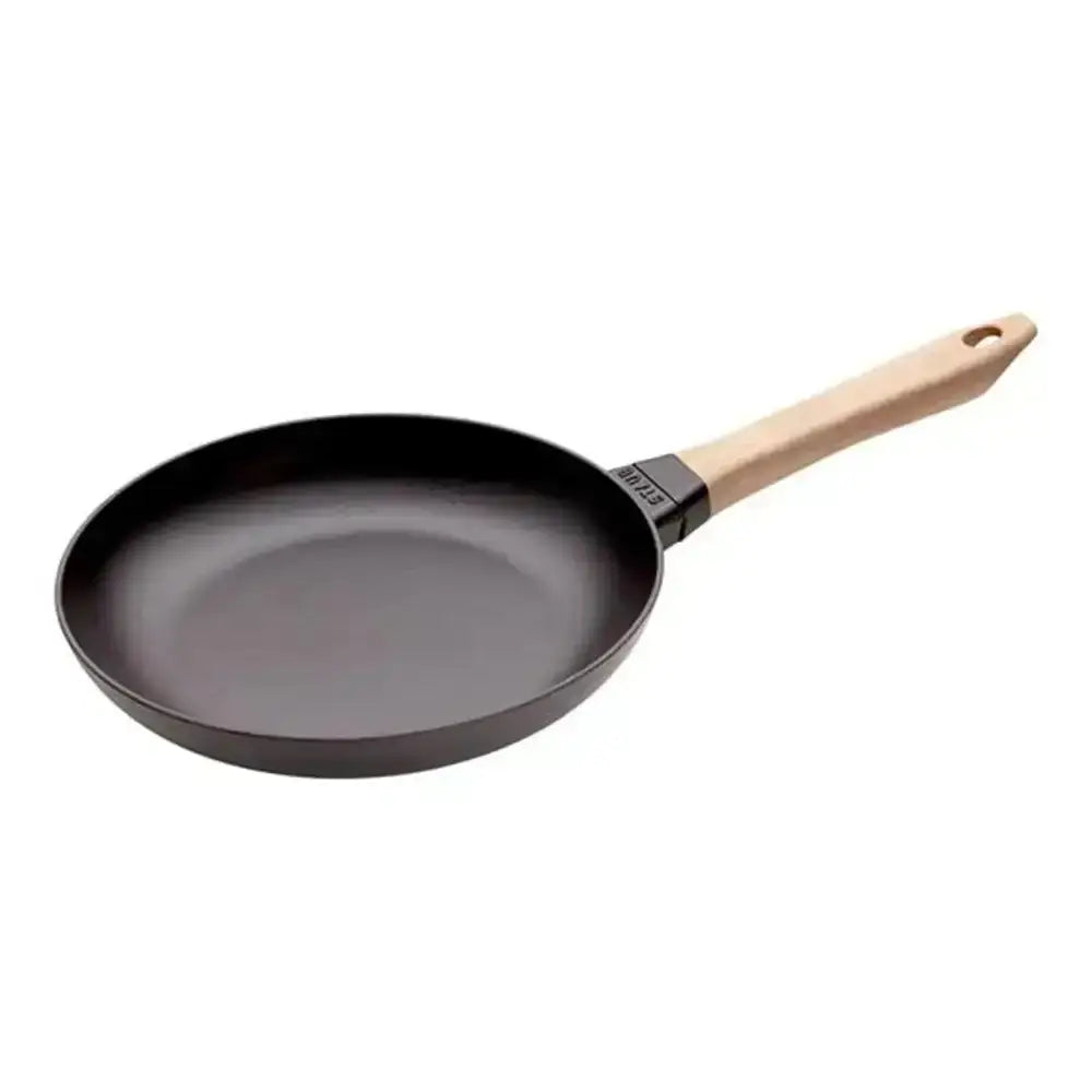 Staub round cast iron frying pan 26cm with black non-stick surface and light wood handle with black metal ferrule