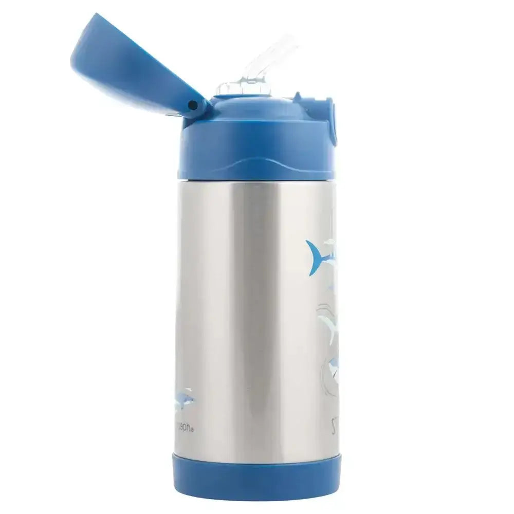 Children's stainless steel water bottle with blue lid and whale design on a white background
