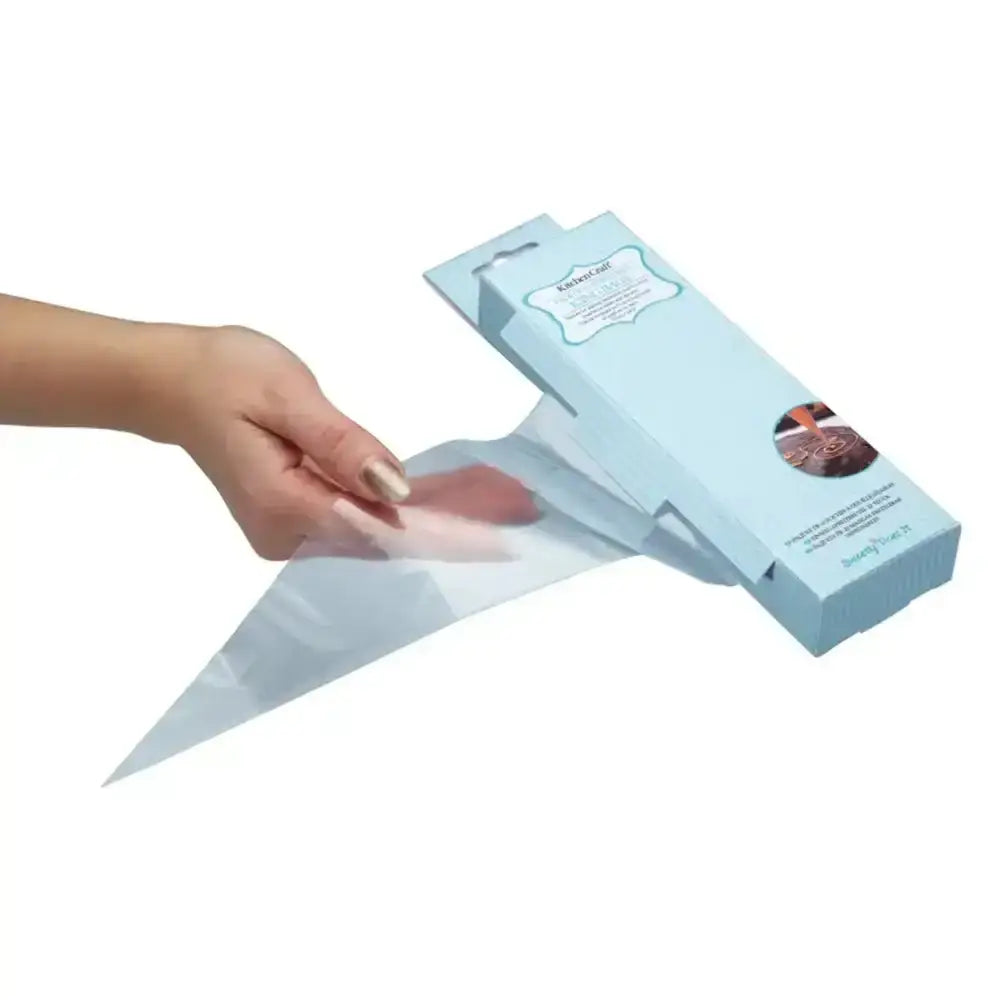 Hand holding a piping bag with a blue packaging box on a white background