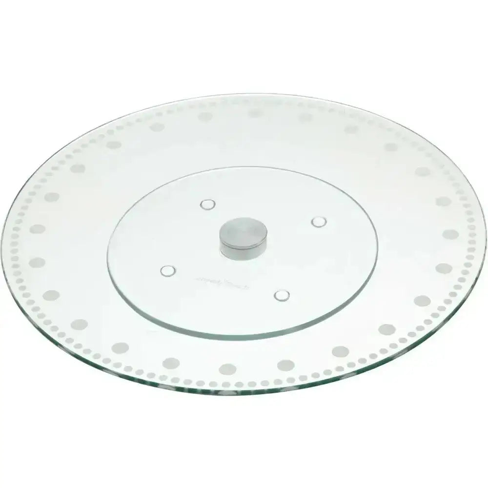 Clear glass cake stand with decorative rim on a white background