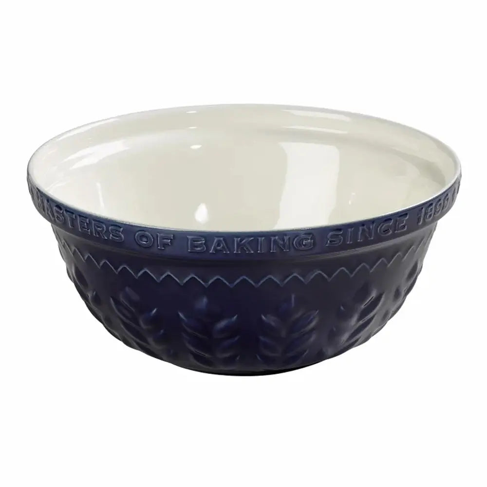 Navy blue ceramic mixing bowl with white interior on a white background