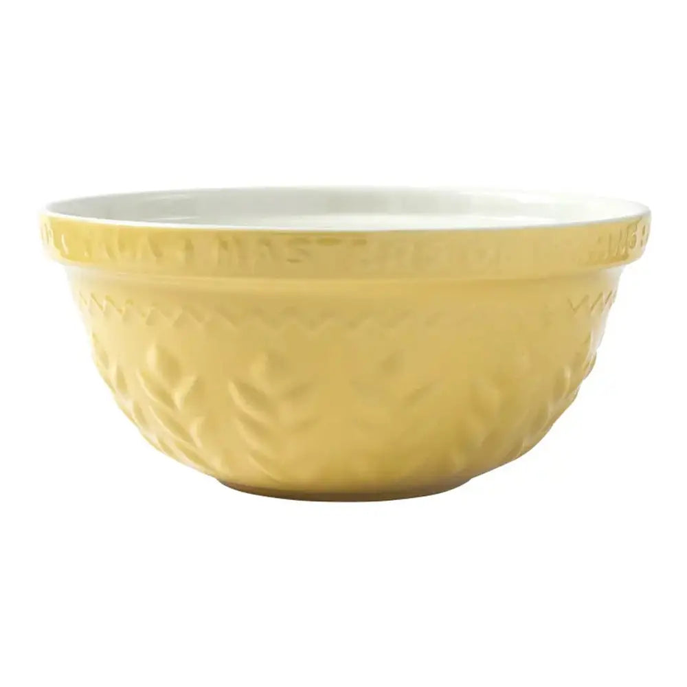 Yellow ceramic mixing bowl with textured surface on a white background