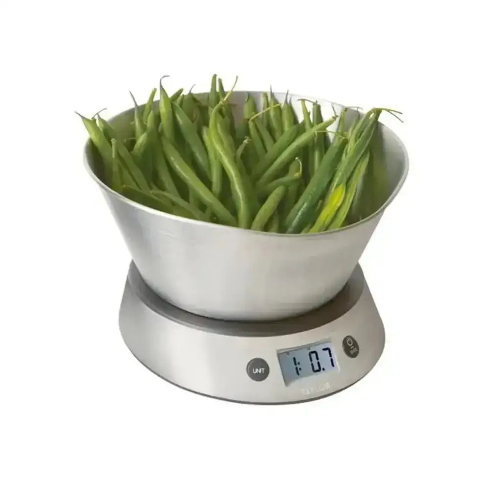 Digital kitchen scale with a bowl of green beans on a white background