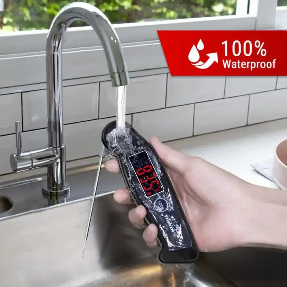 Digital water quality tester being used under a running faucet with a kitchen sink in the background.
