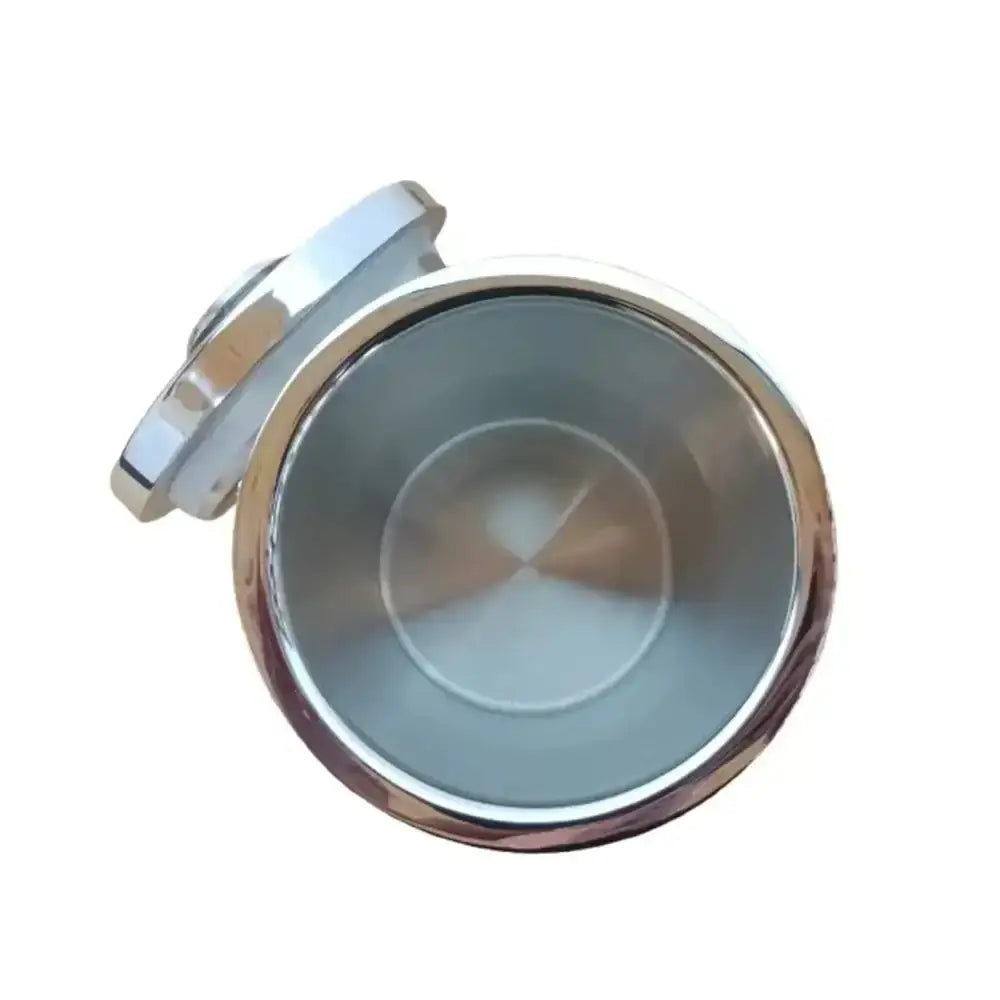 Shiny chrome finished round pill box with hinged lid and reflective interior for secure storage