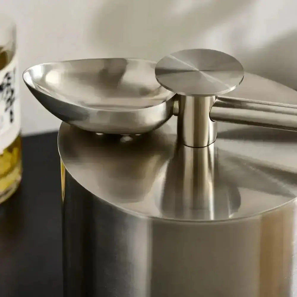 Tiara stainless steel insulated ice bucket with scoop 2.8l featuring a polished stainless steel oil dispenser with ergonomic handle