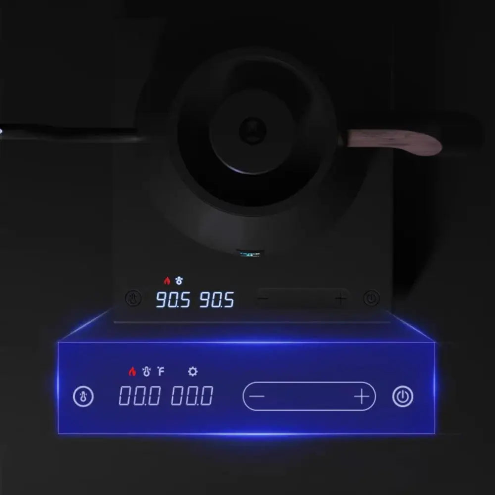 Black induction cooktop with digital display and control panel on a dark background