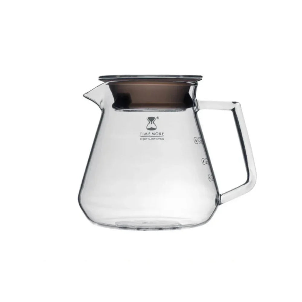 Clear glass coffee server with wooden lid on a white background