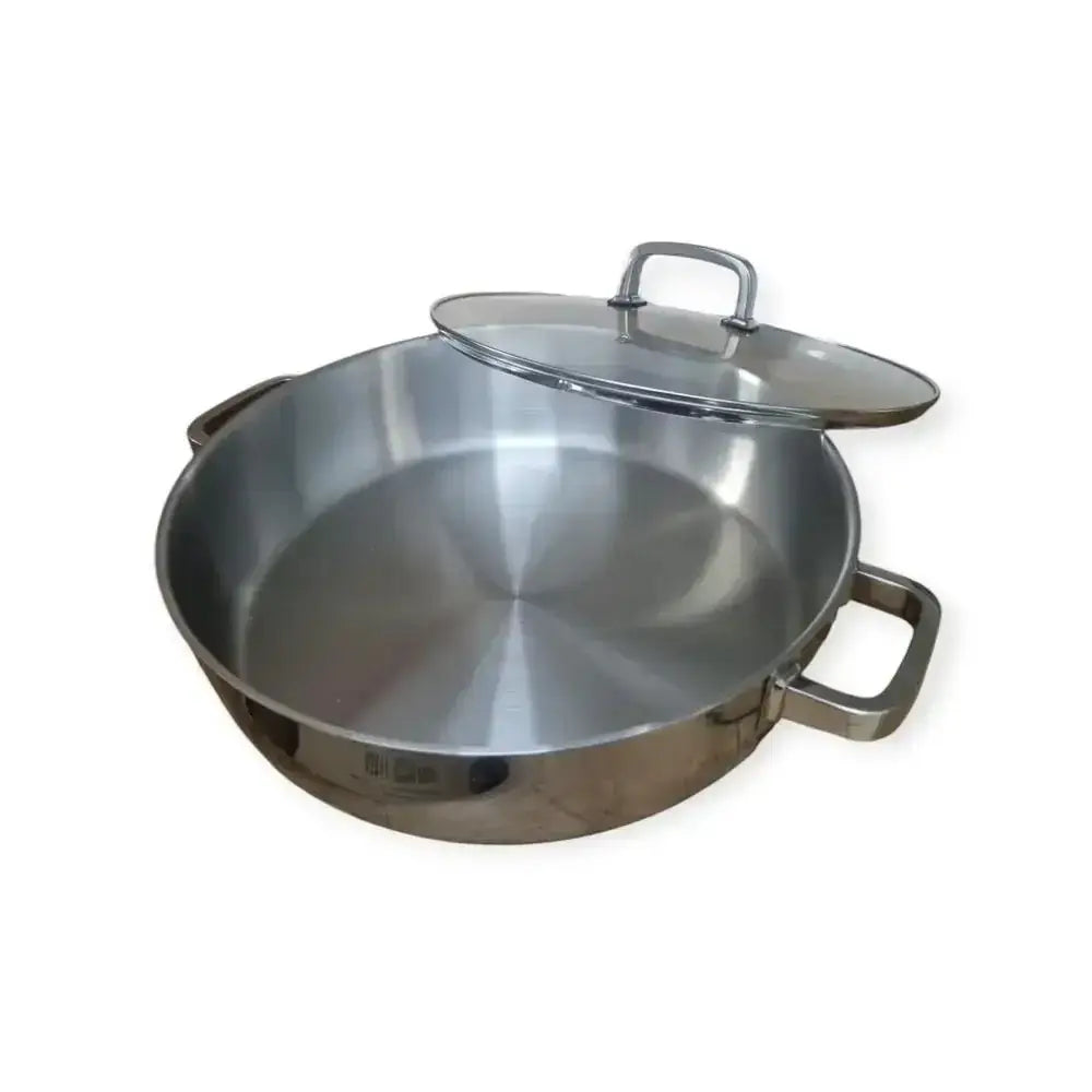 Stainless steel frying pan with lid on a white background