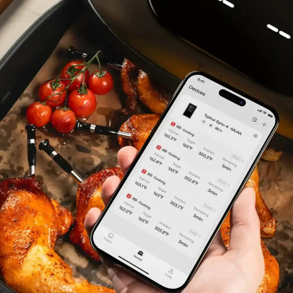 Person holding a phone with cooked meat and vegetables in the background.