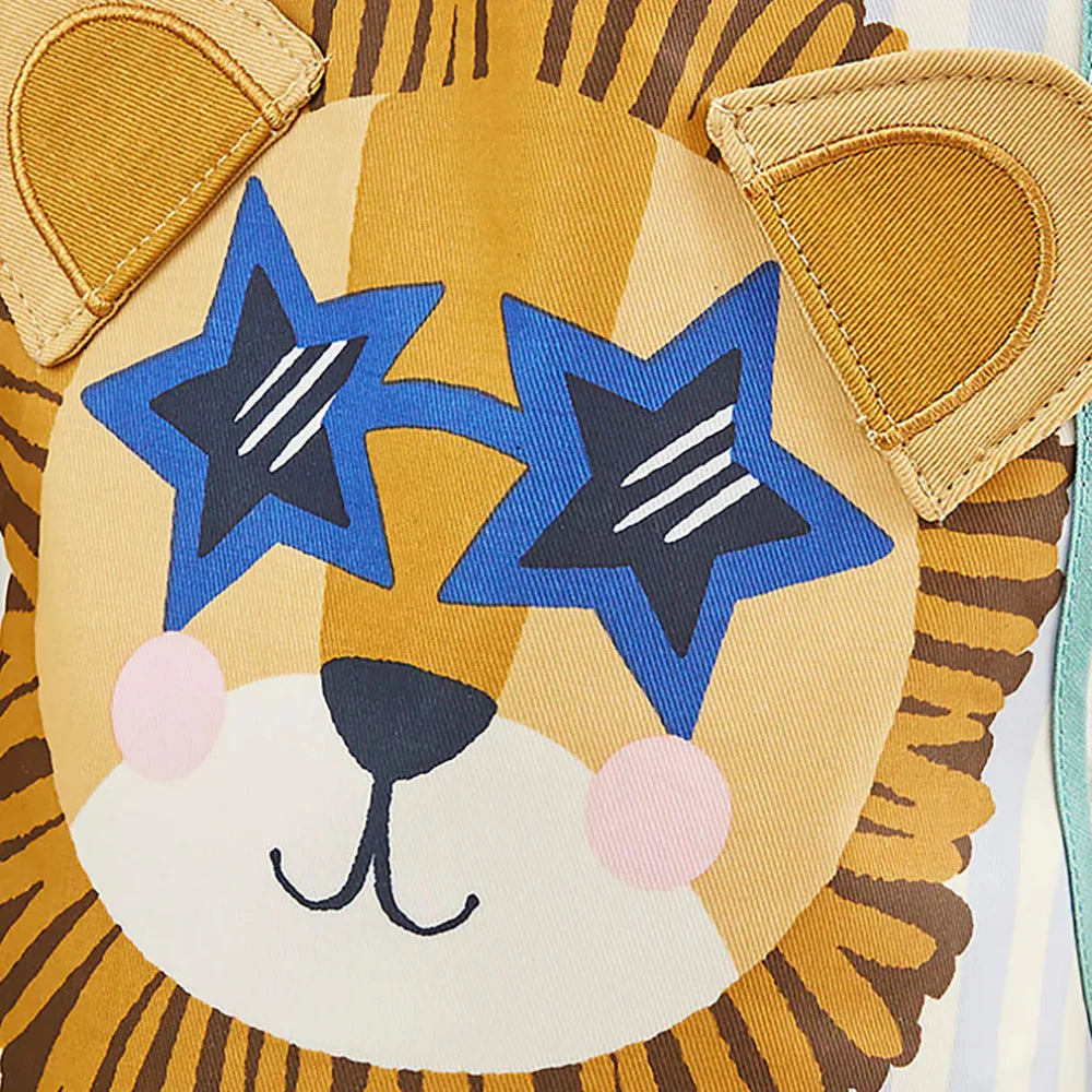 Close-up of a lion toy with star-shaped eyes on a white background