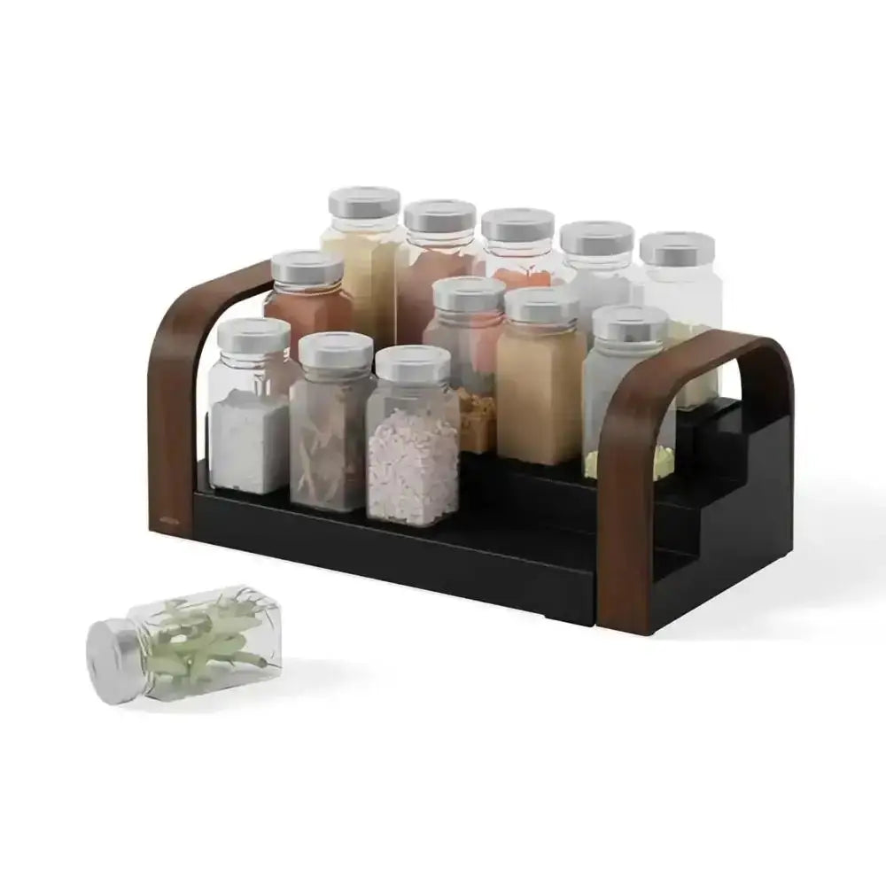 Wooden spice rack with various spice bottles on a white background