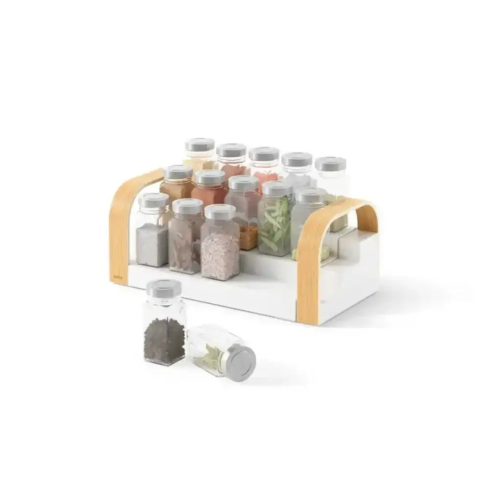 Spice rack with various spice bottles on a white background
