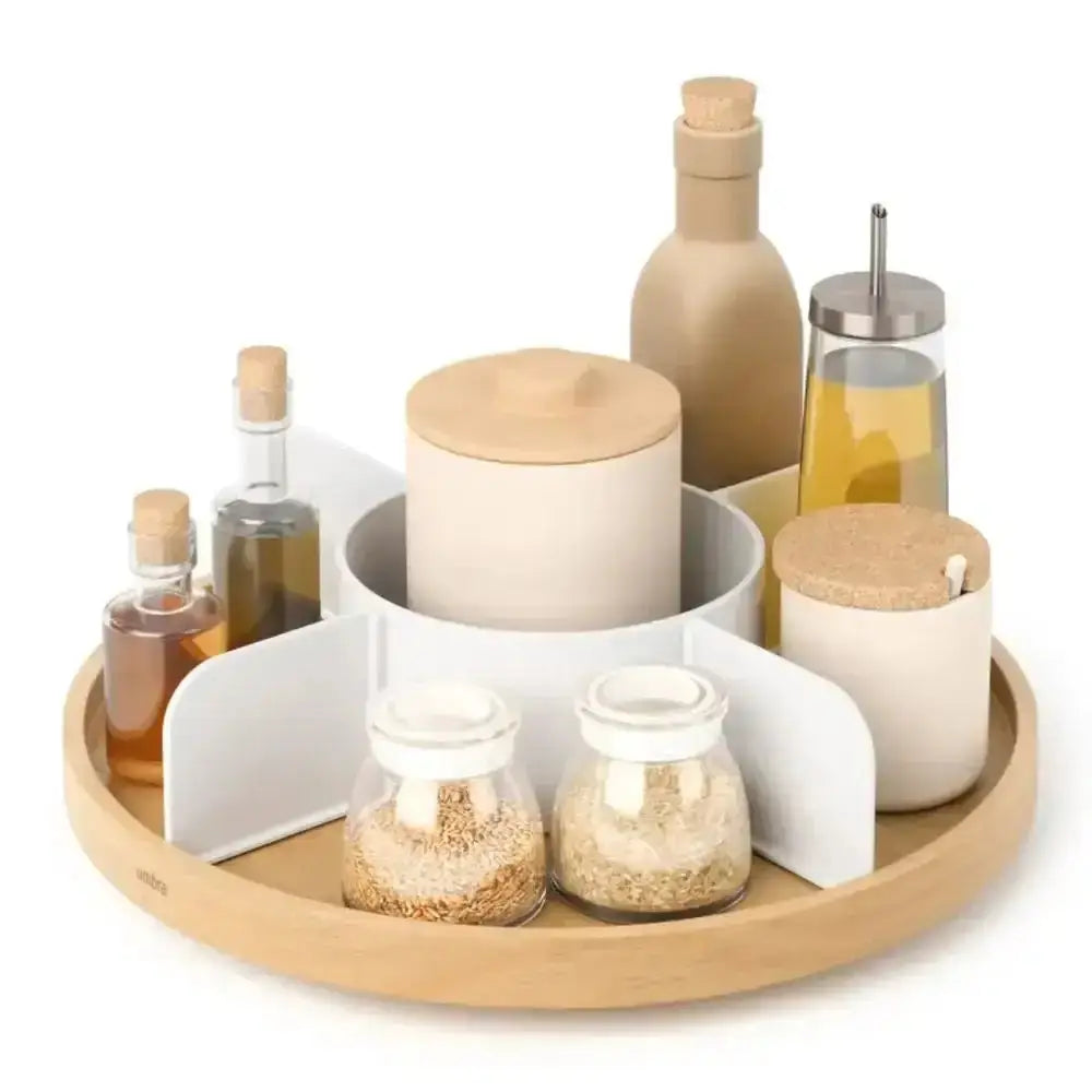 Decorative tray with various jars and bottles on a white background