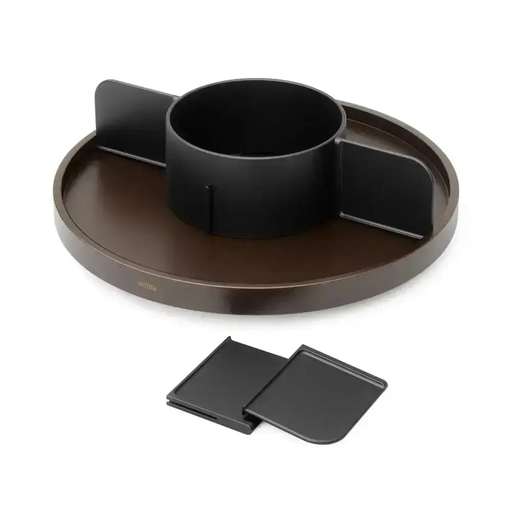 Black lazy susan with additional black trays on a white background
