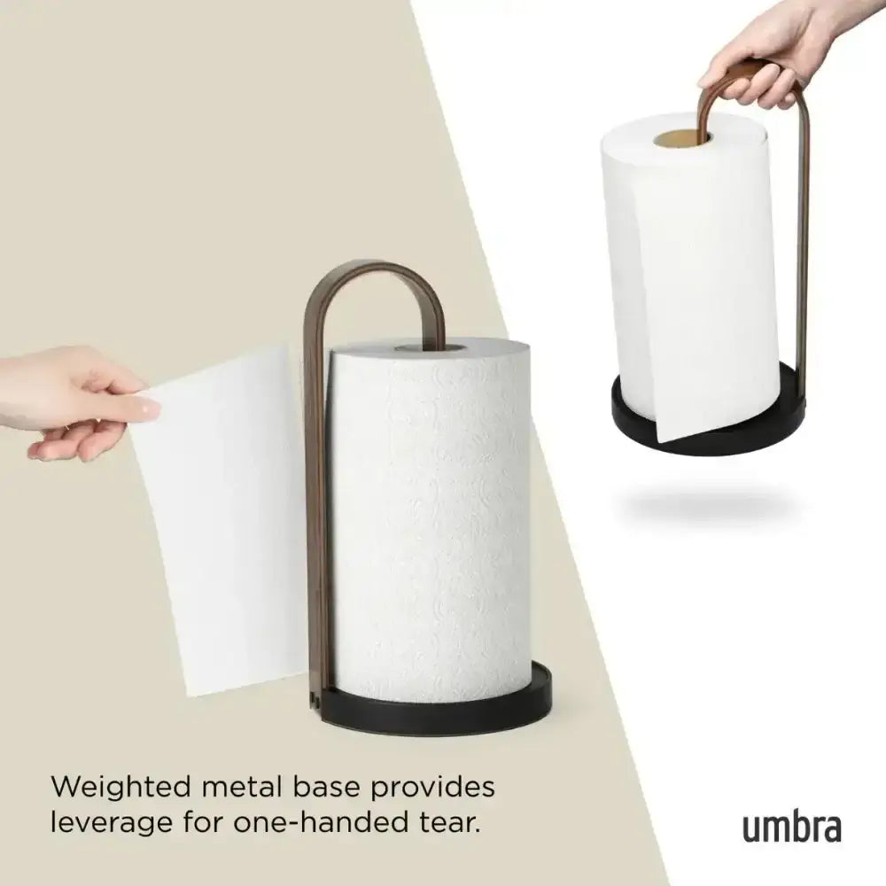 Umbra paper towel holder with hands using it on a beige background