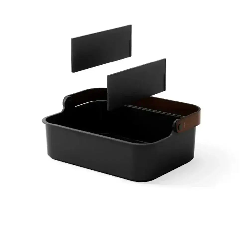 Black rectangular box with a brown handle on a white background