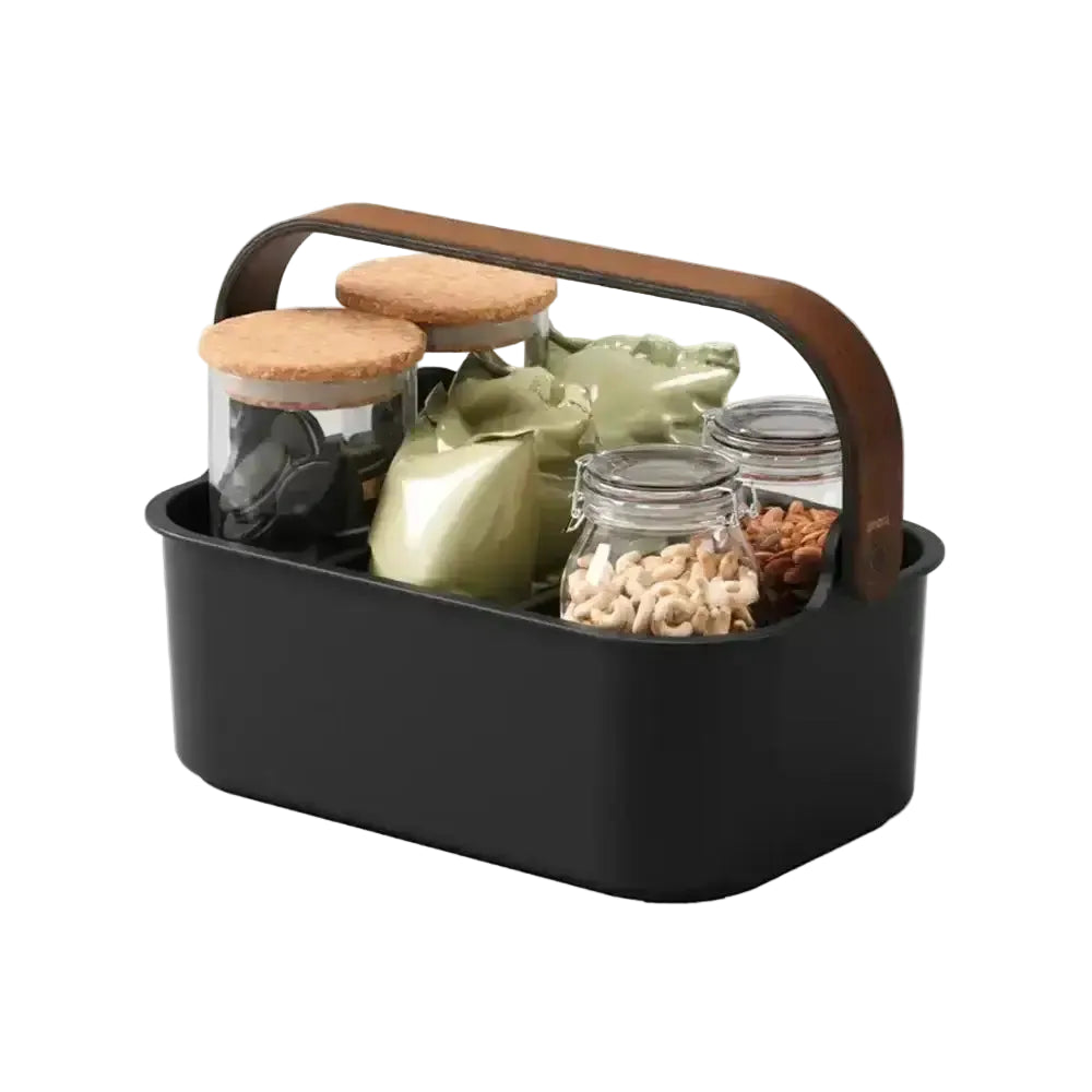 Black carrying basket with jars and items on a white background