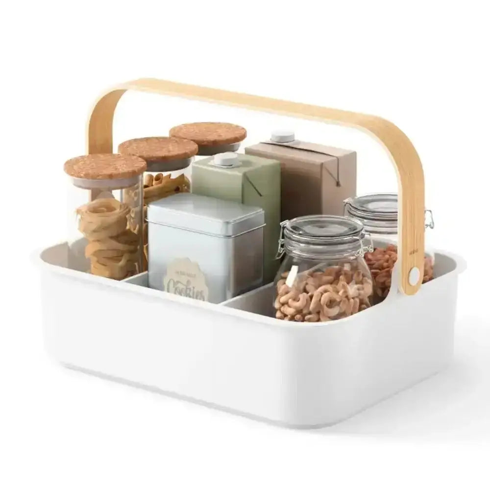 White storage caddy with wooden handle containing various food items and containers on a white background