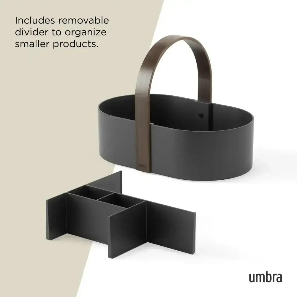 Black basket with brown handle and removable divider on a white background, featuring the Umbra brand.