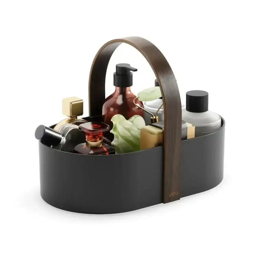 Black and brown caddy with various bottles and items on a white background