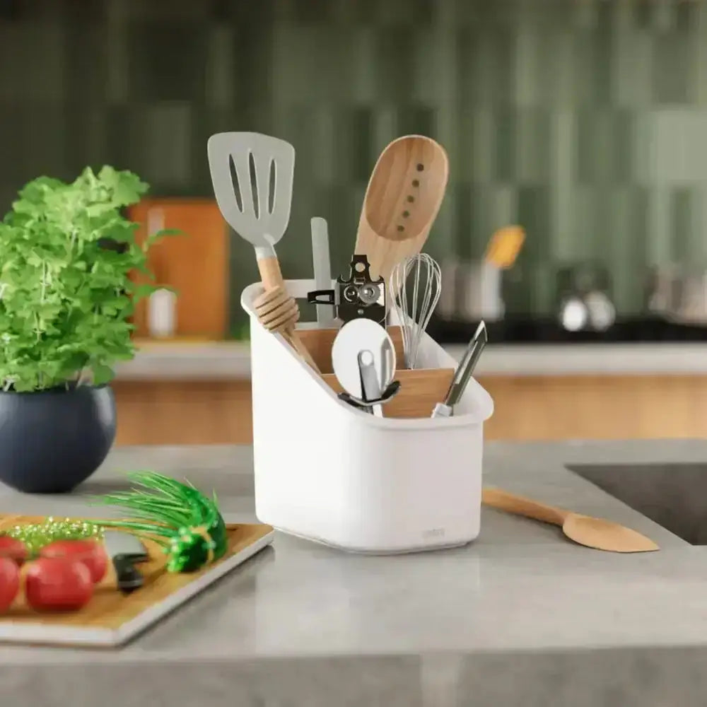 Kitchen utensil holder with utensils on a kitchen counter