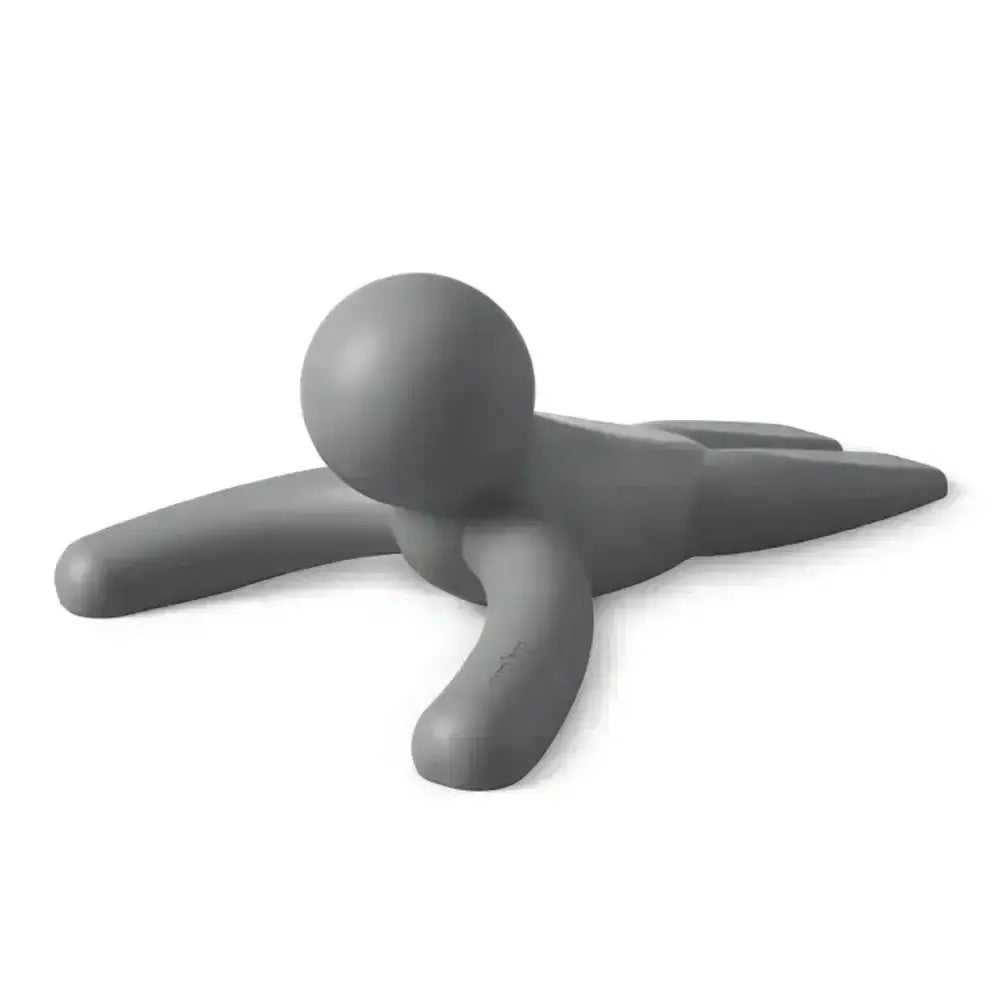 Gray plastic tool shaped like a person on a white background