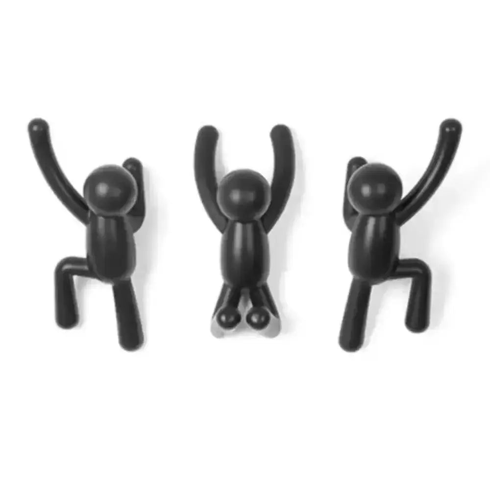 Three black abstract figure wall hooks on a white background