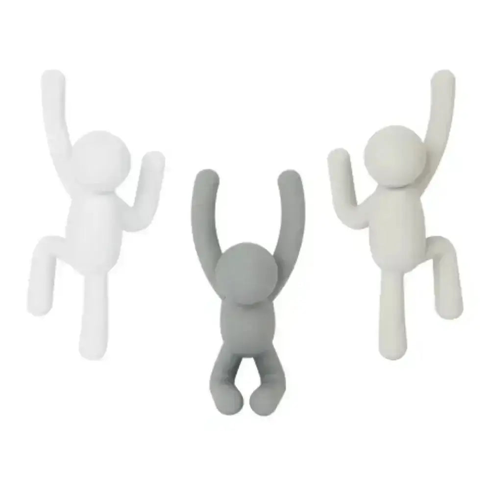 Three white and gray abstract figure sculptures on a white background