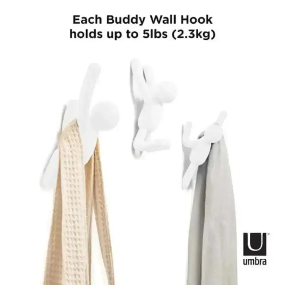 Buddy Wall Hook holding towels with text indicating weight capacity and Umbra logo.