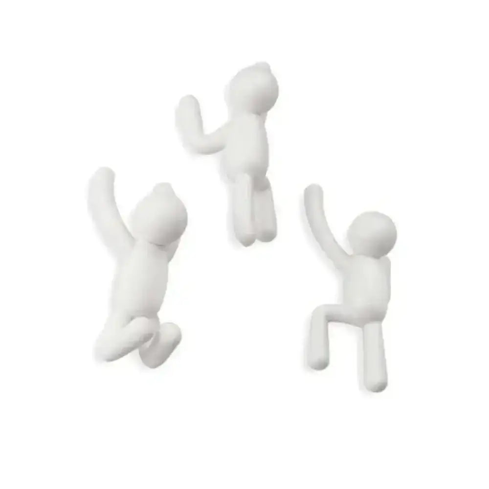 Three white abstract human figure sculptures on a white background