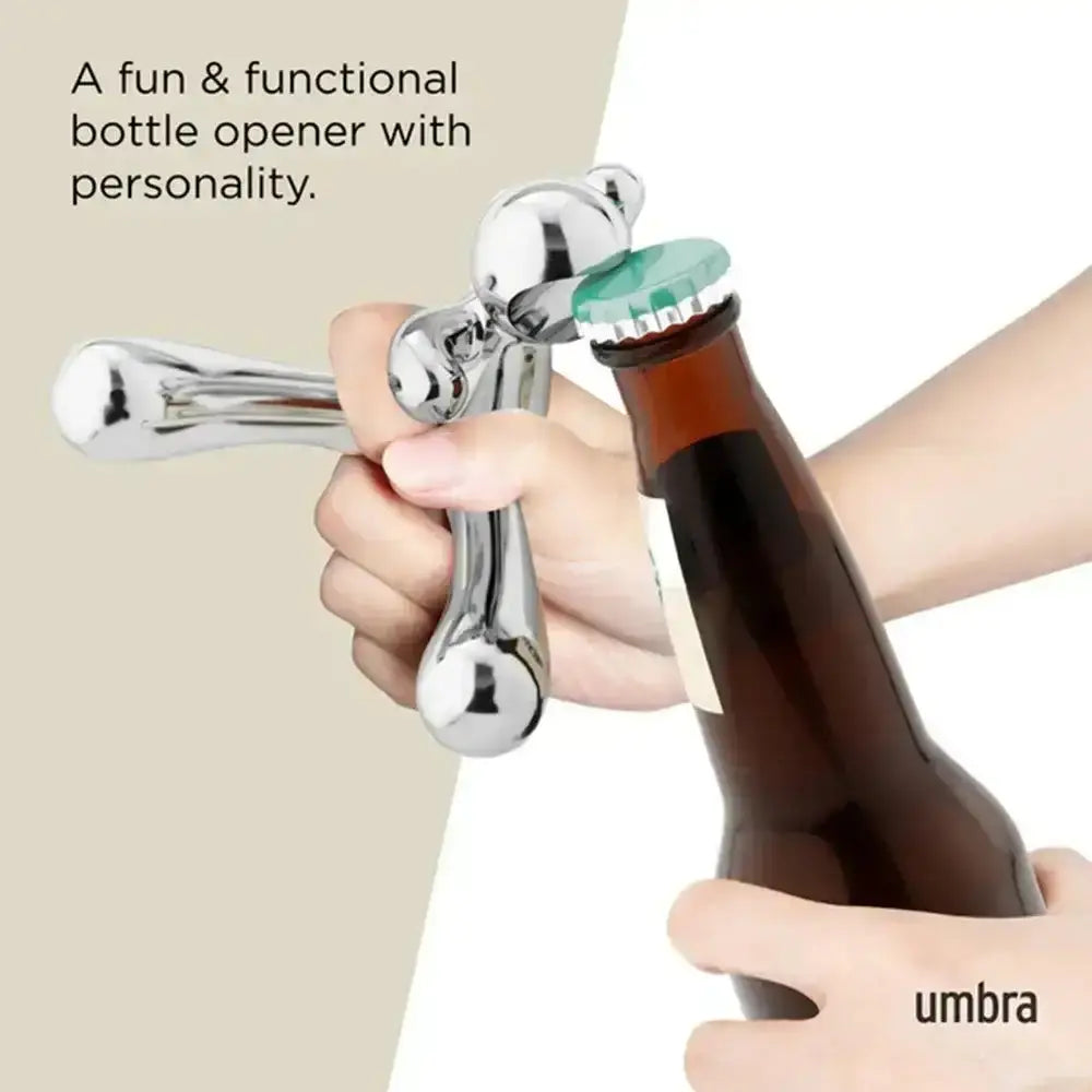 Bottle opener being used on a bottle with 'umbra' branding.